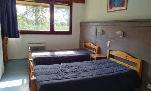 Chambre double confortable au Chalet du Ticou